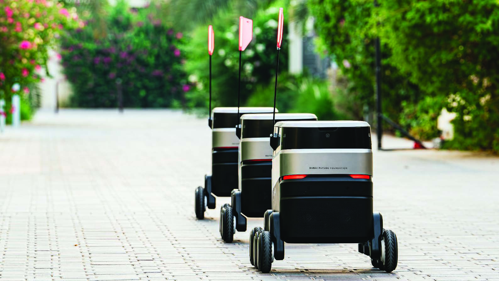 Delivery robots on a path in The Sustainable City