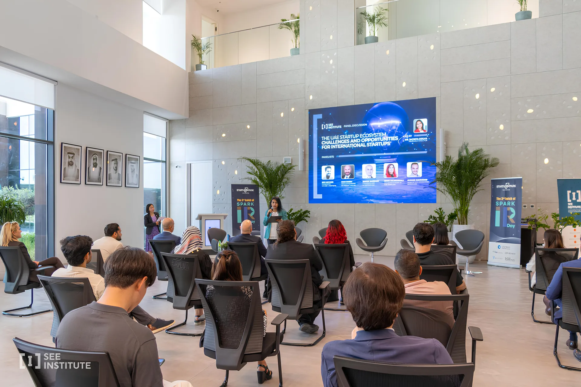 A panel discussion in the SEE Institute atrium